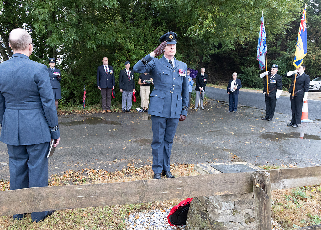 Wing Commander Steve Jones, Salutes the memorial after laying a wreath on behalf of the RAF Brize Norton Station Commander Group Captain Macartney.